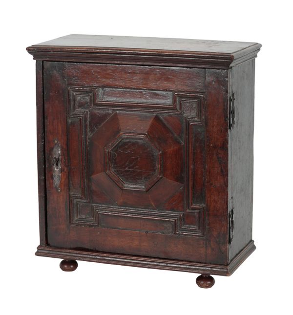 AN OLD OAK SPICE CABINET OF 17TH CENTURY DESIGN
