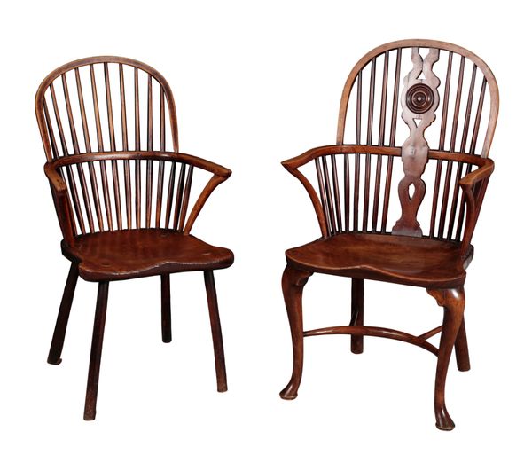 AN EARLY 19TH CENTURY ASH AND ELM 'PRIMITIVE' COMB BACK WINDSOR ARMCHAIR