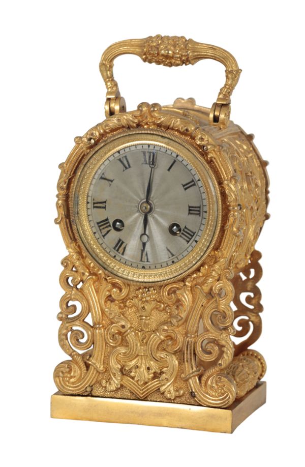 A LATE 19TH CENTURY CONTINENTAL BRASS MANTLE CLOCK