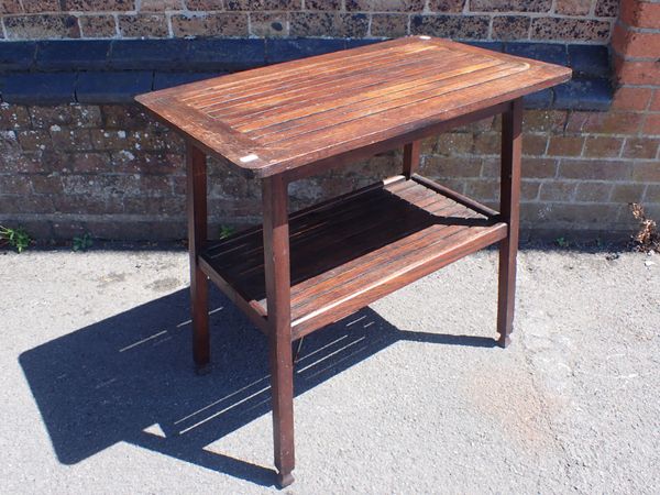 A TEAK GARDEN TABLE MADE FROM H.M.S 'WEYMOUTH'