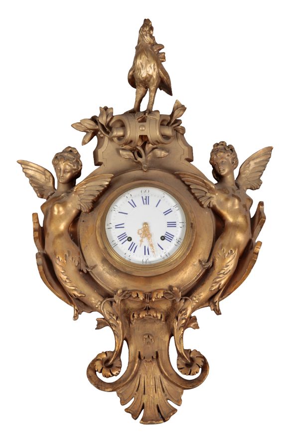 A FRENCH BRASS CARTEL CLOCK OF ROCOCO DESIGN