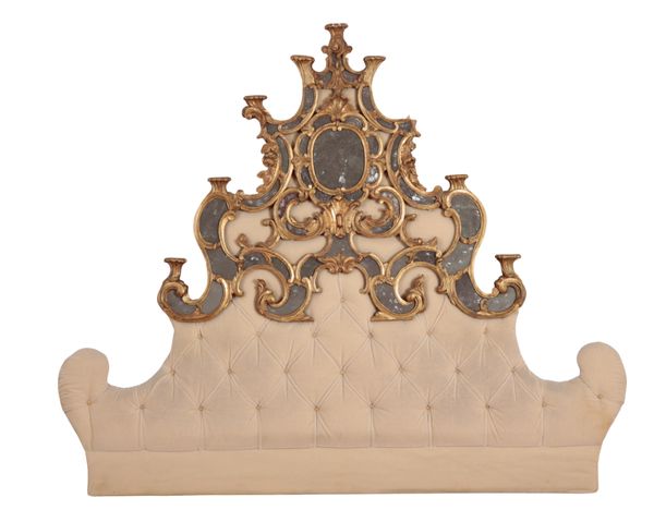 A PARCEL GILT, REVERSE PAINTED GLASS AND FABRIC HEADBOARD OF FRENCH ROCOCO DESIGN