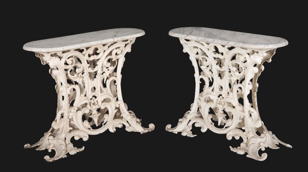 A PAIR OF WHITE-PAINTED CAST IRON CONSOLE TABLES