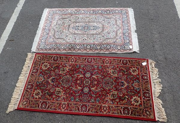 A SMALL MODERN PERSIAN RUG