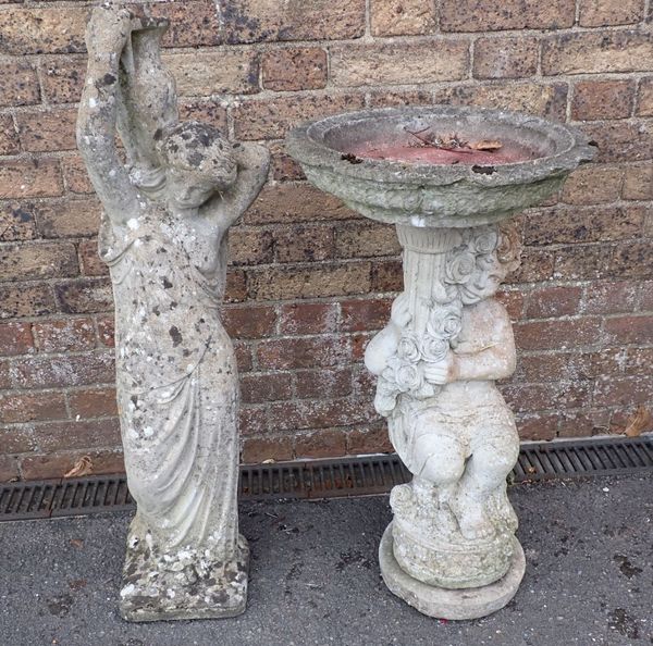 A RECONSTITUTED STONE BIRD BATH, ON FIGURAL BASE