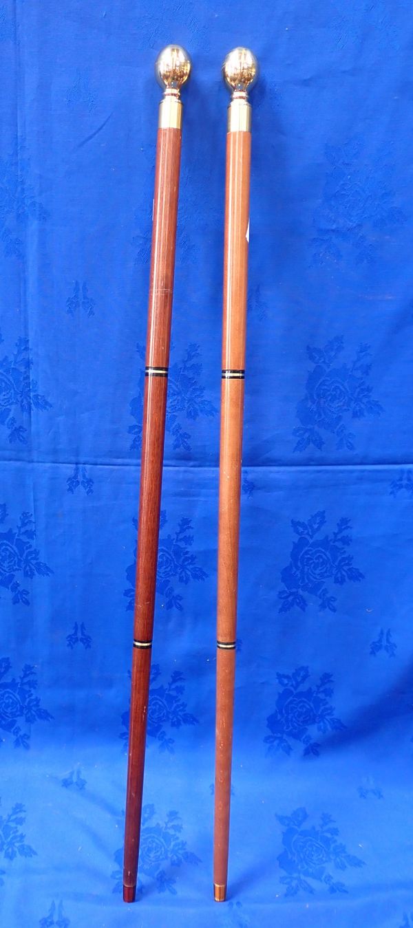 A PAIR OF WALKING STICKS, BOTH WITH A COMPASS