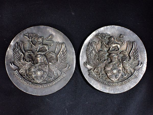 A PAIR OF FILLED SIVER PLAQUES, WITH THE CREST OF THE BBC