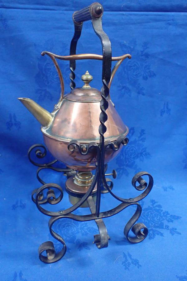 A COPPER KETTLE AND WROUGHT-IRON STAND, IN THE STYLE OF DR. CHRISTOPHER DRESSER