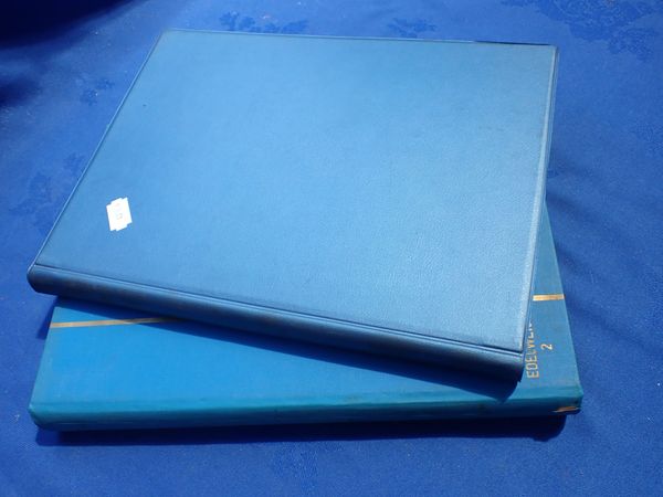 TWO STAMP ALBUMS CONTAINING VARIOUS BELGIUM STAMPS