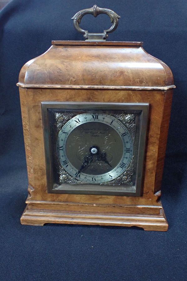 AN ELLIOTT CLOCK, RETAILED BY GARRARD & CO LTD, LONDON