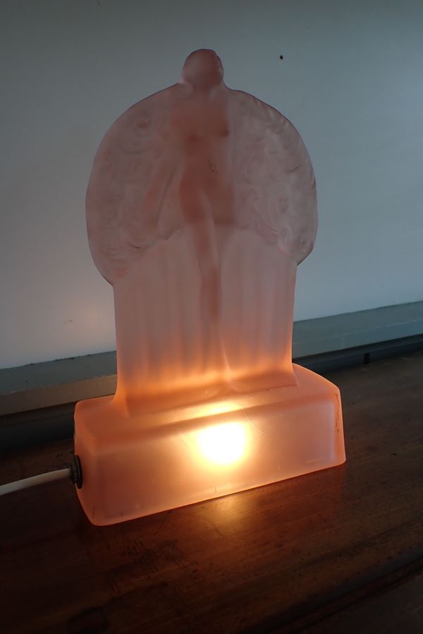 AN ART DECO PINK GLASS FIGURAL LAMP