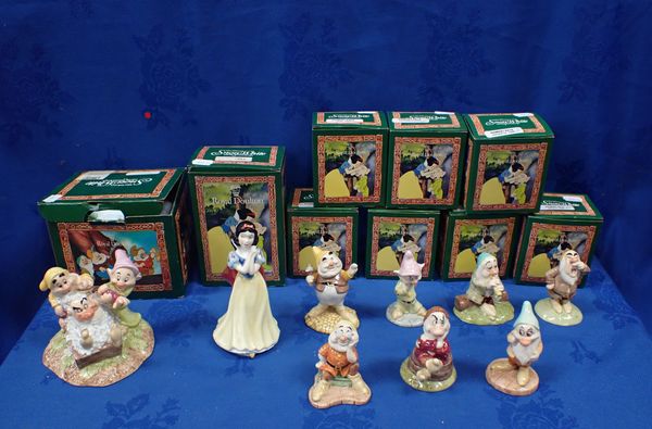 A COLLECTION OF ROYAL DOULTON 'SNOW WHITE AND THE SEVEN DWARFS' FIGURINES