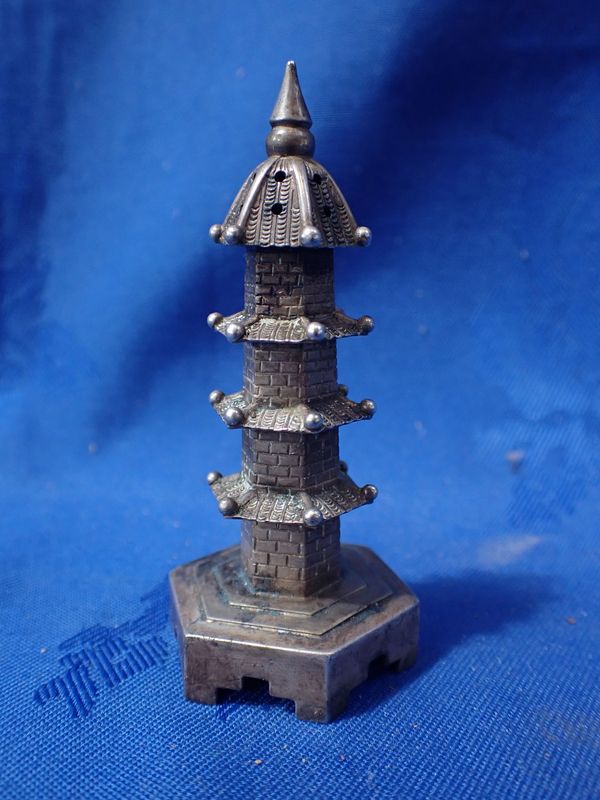 A CHINESE SILVER PAGODA PEPPERETTE