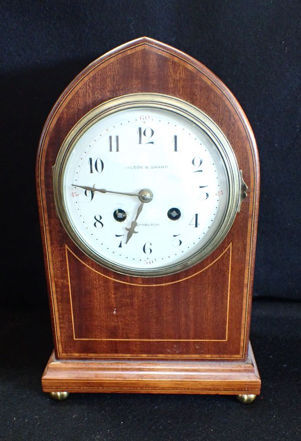 AN EDWARDIAN MAHOGANY CASED MANTEL CLOCK