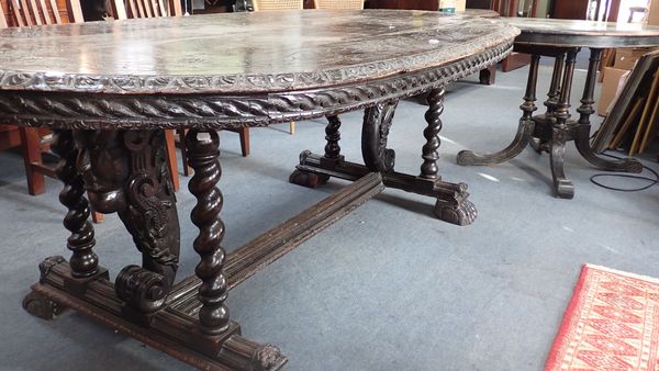 A 19TH CENTURY CARVED OAK DINING TABLE