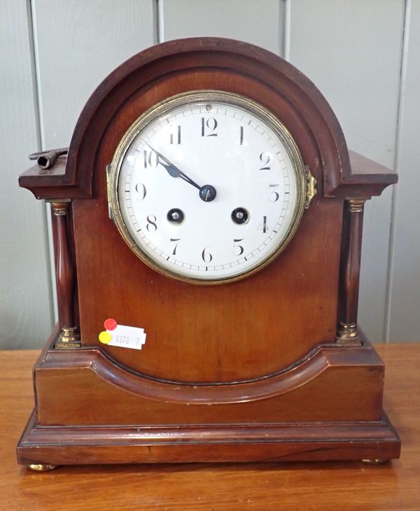 AN EDWARDIAN MAHOGANY MANTEL CLOCK