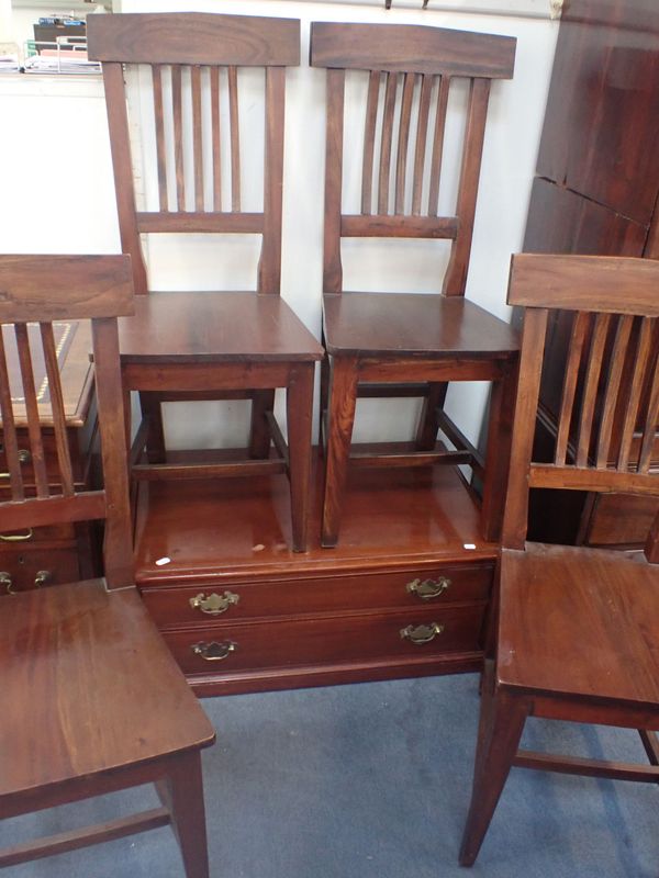 A SET OF FOUR STAINED WOOD DINING CHAIRS
