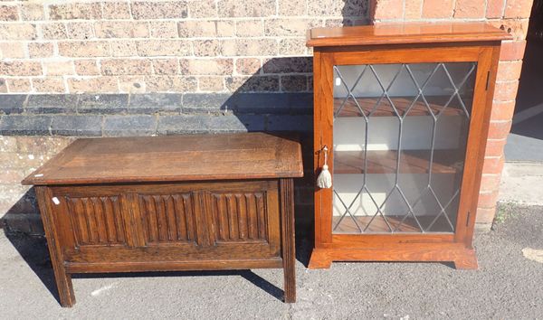 A GLAZED OAK BOOKCASE