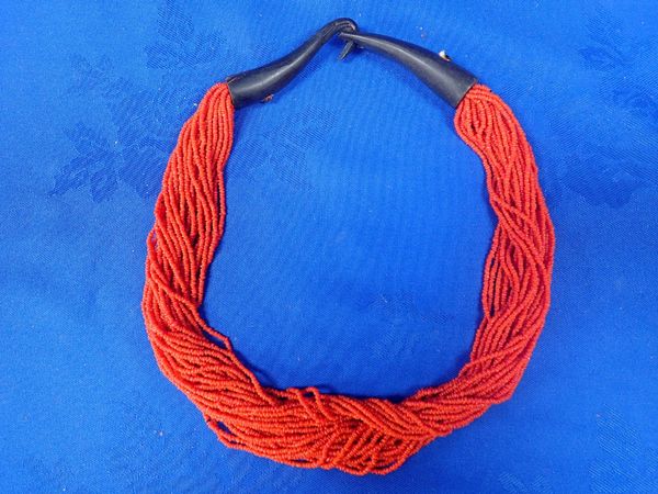 A MULTI-STRAND CORAL BEAD NECKLACE