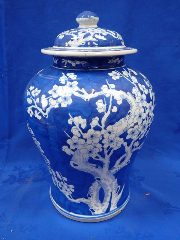 A CHINESE BLUE AND WHITE PRUNUS VASE AND COVER