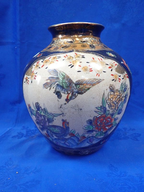 A CHINESE VASE WITH PAINTED RESERVES ON A DARK GROUND