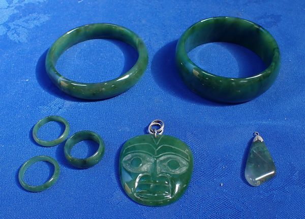 A GREENSTONE TIKI STYLE PENDANT