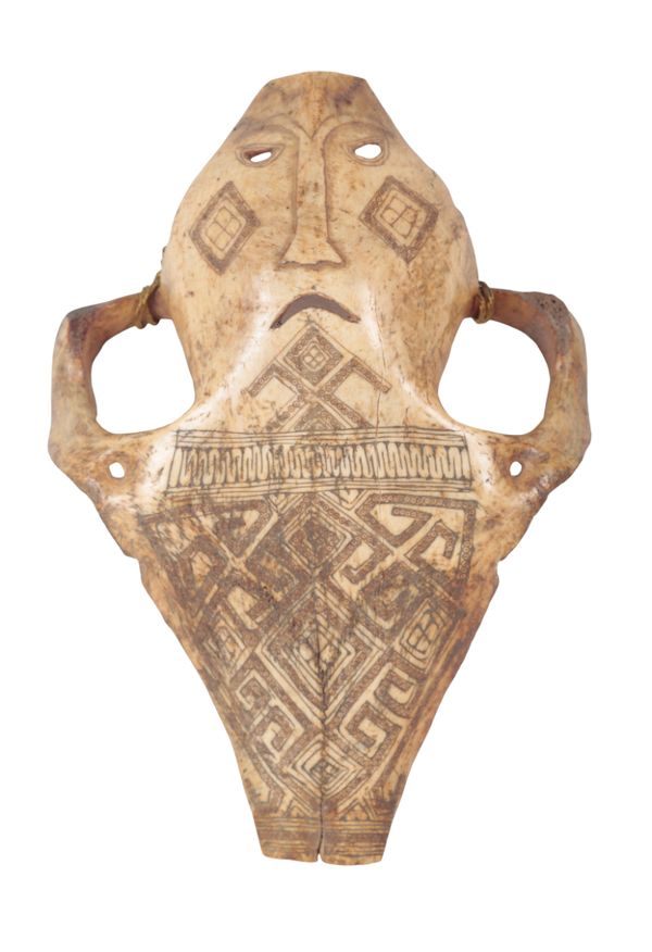 A PAPUA NEW GUINEA CARVED BONE MASK