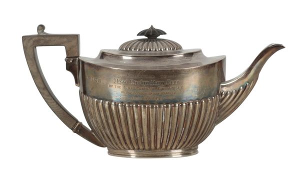 AN EDWARDIAN SILVER TEAPOT BY MARTIN, HALL & CO.