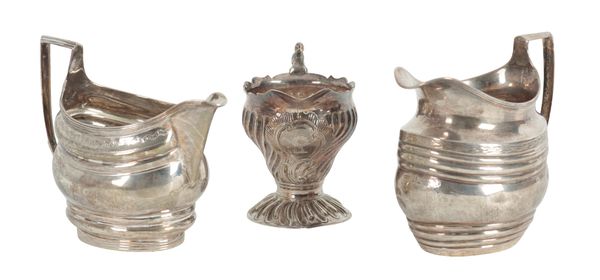 A GROUP OF THREE SILVER JUGS