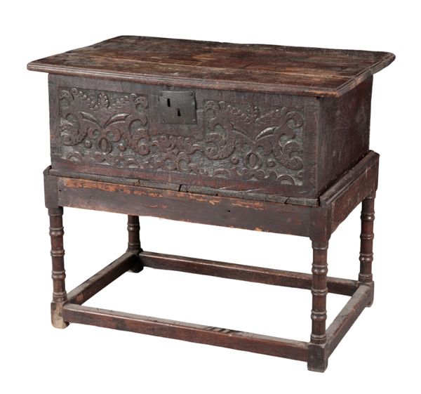 A CHARLES II STYLE OAK CHEST ON STAND