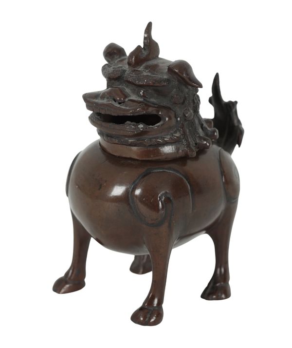 A CHINESE BRONZE DOG CENSER