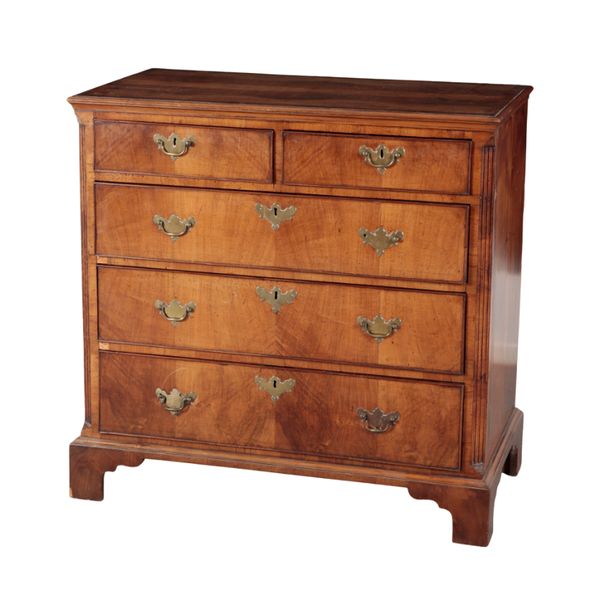 A GEORGE III WALNUT CHEST OF DRAWERS