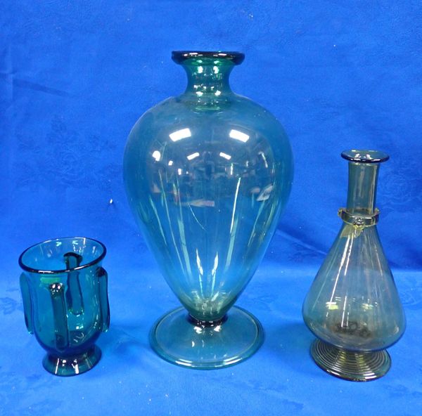 A GREEN GLASS VASE WITH BROAD FOLDED FOOT