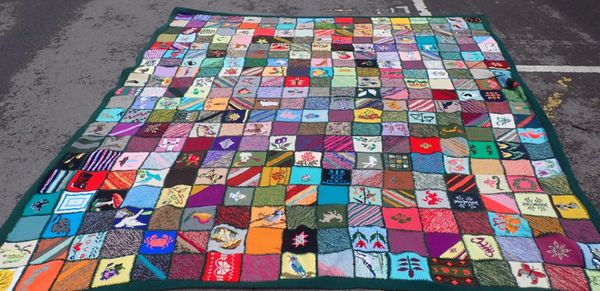 A LARGE HAND KNITTED FRIENDSHIP BLANKET