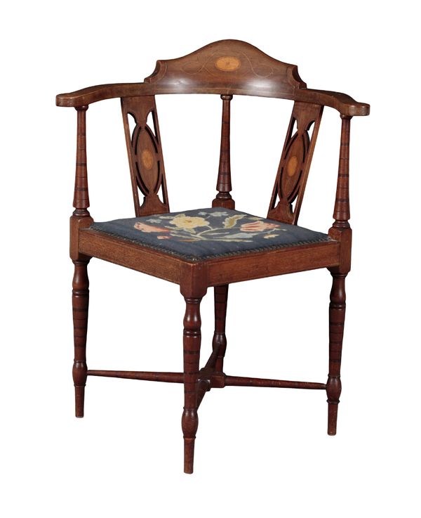 AN EDWARDIAN MAHOGANY CORNER ARMCHAIR