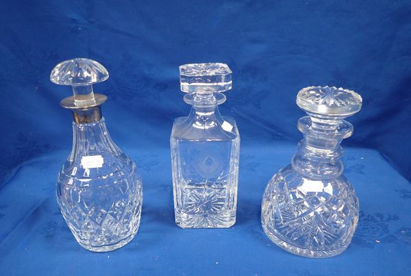 THREE CUT-GLASS DECANTERS