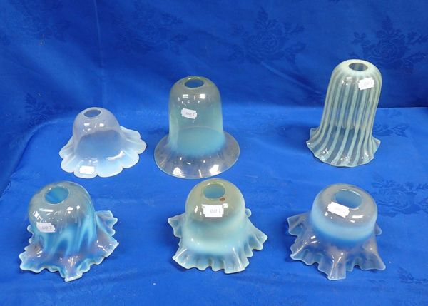 A COLLECTION OF VASELINE GLASS SHADES