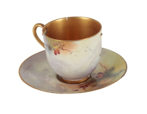 A ROYAL WORCESTER BONE CHINA  'PEACOCK' CABINET CUP AND SAUCER BY SEAGLEY