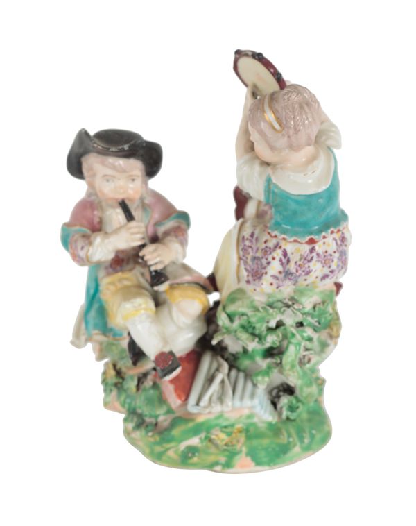 AN 18TH CENTURY DUESBURY & CO DERBY PORCELAIN FIGURE - CHILD MUSICIANS