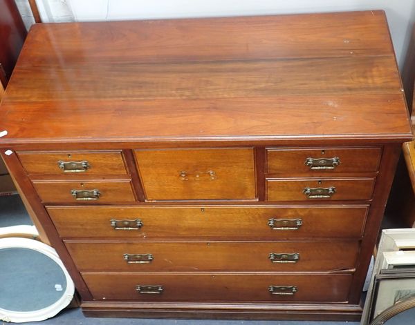 AN EDWARDIAN WALNUT CHEST OF DRAWERS