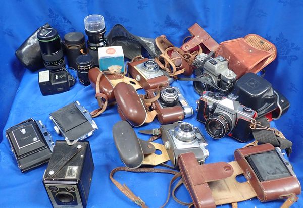 A COLLECTION OF CAMERAS AND LENSES