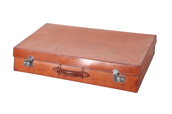 AN EDWARDIAN BROWN LEATHER SLOPING-FRONT CAR CASE