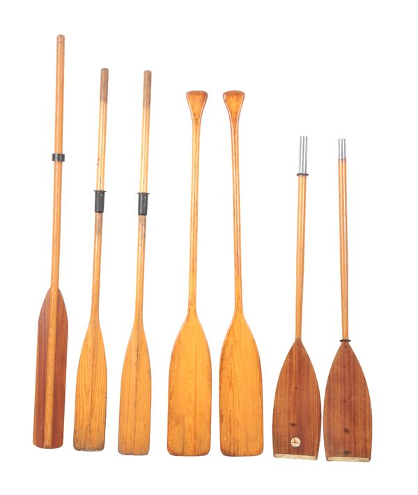 A GROUP OF SEVEN VINTAGE WOODEN OARS