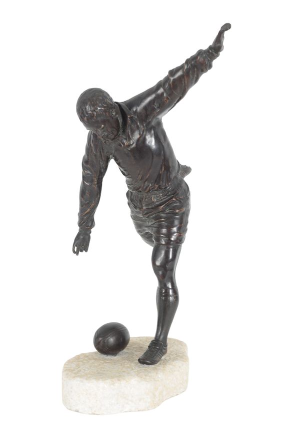 A LARGE BRONZE MODEL OF A RUGBY PLAYER