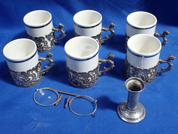 SIX SILVER ROCOCO STYLE DEMITASSE HOLDERS