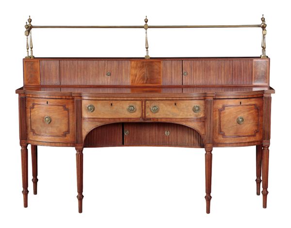 A GEORGE III MAHOGANY AND BRASS MOUNTED SIDEBOARD IN THE MANNER OF GILLOWS