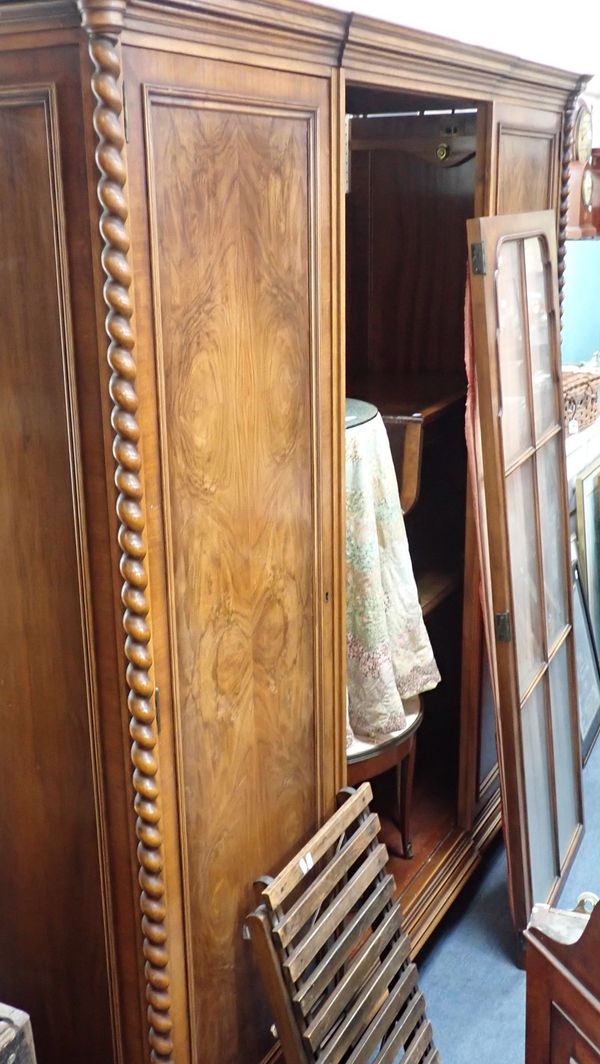 A CONTINENTAL WALNUT WARDROBE