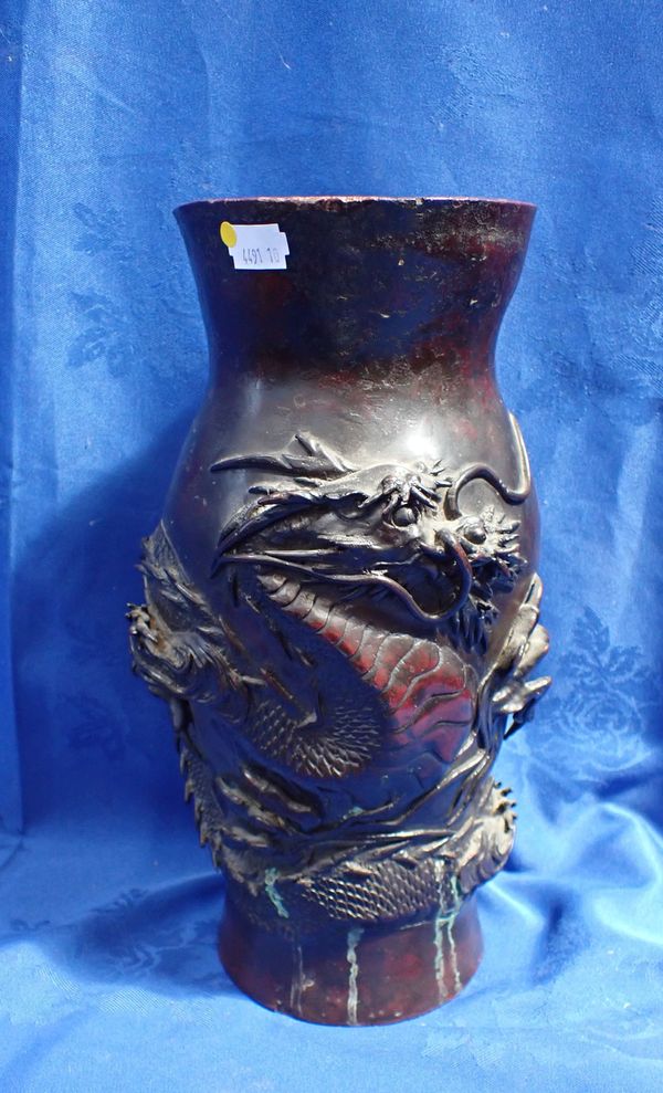 A BRONZE CHINESE VASE WITH ENTWINED DRAGON DECORATION