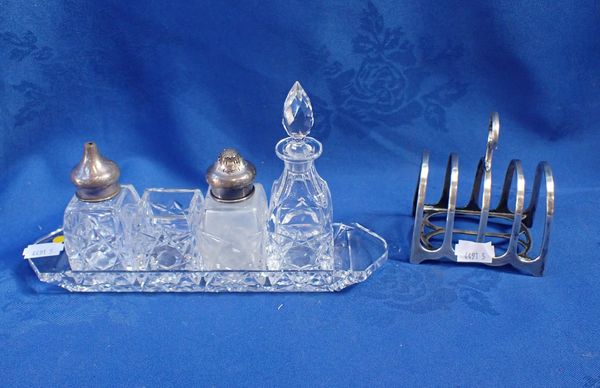 A SILVER TOPPED CUT GLASS CRUET SET