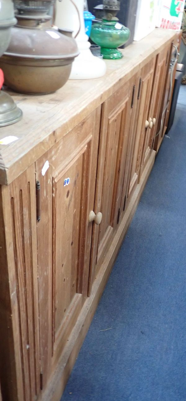 A VICTORIAN STYLE PINE FOUR-DOOR SIDE CABINET